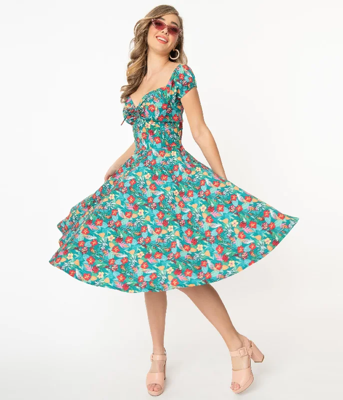 Ruffled Women Dress with Multiple Layers for a Playful and Girly StyleRuffled Women Dress with Multiple Layers for a Playful and Girly StyleTeal & Multicolor Tropical Floral Print Preston Swing Dress